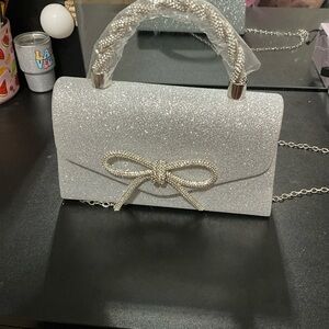 Elegant Silver Handbag with Bow Accent